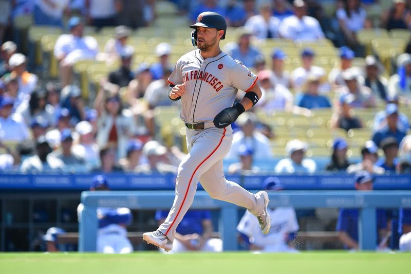 Jul 25, 2024; Los Angeles, California, USA; San Francisco Giants outfielder Michael Conforto (8) scores a run against the Los Angeles Dodgers during the eighth inning at Dodger Stadium. Mandatory Credit: Gary A. Vasquez-USA TODAY Sports