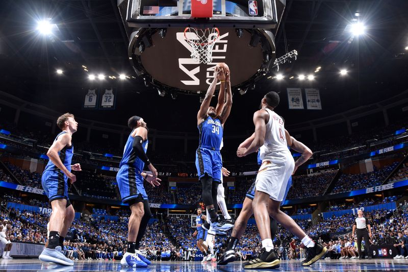 ORLANDO, FL - APRIL 27: Wendell Carter Jr. #34 of the Orlando Magic rebounds the ball during the game against the Cleveland Cavaliers during Round 1 Game 4 of the 2024 NBA Playoffs on April 27, 2024 at the Kia Center in Orlando, Florida. NOTE TO USER: User expressly acknowledges and agrees that, by downloading and or using this photograph, User is consenting to the terms and conditions of the Getty Images License Agreement. Mandatory Copyright Notice: Copyright 2024 NBAE (Photo by Fernando Medina/NBAE via Getty Images)