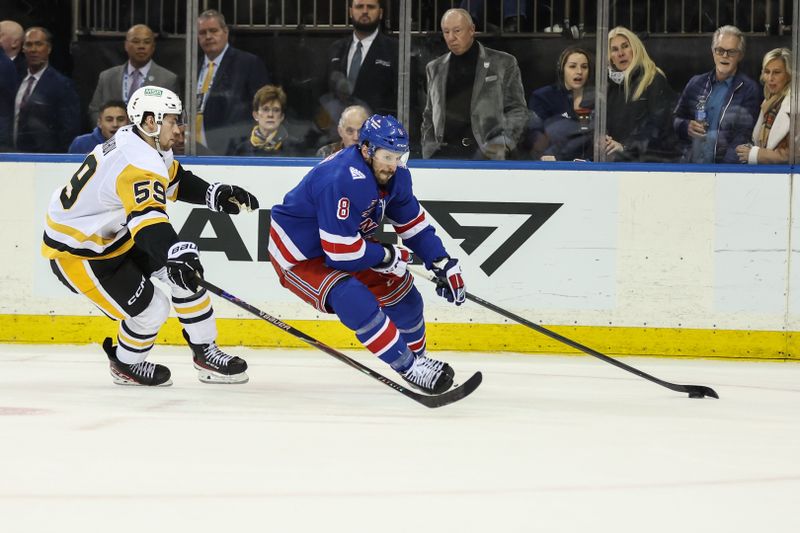 Feb 28, 2026; New York, New York, USA;  Pittsburgh Penguins right wing Egor Chinakhov (59) and New York Rangers center J.T. Miller (8) battle for control of the puck in overtime at Madison Square Garden. Mandatory Credit: Wendell Cruz-Imagn Images