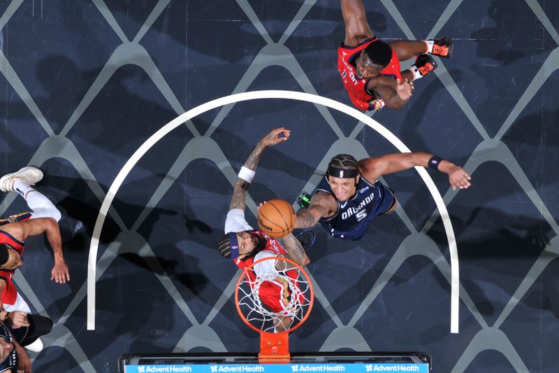 ORLANDO, FL - MARCH 21: Paolo Banchero #5 of the Orlando Magic drives to the basket during the game against the New Orleans Pelicans on March 21, 2024 at Amway Center in Orlando, Florida. NOTE TO USER: User expressly acknowledges and agrees that, by downloading and or using this photograph, User is consenting to the terms and conditions of the Getty Images License Agreement. Mandatory Copyright Notice: Copyright 2024 NBAE (Photo by Fernando Medina/NBAE via Getty Images)