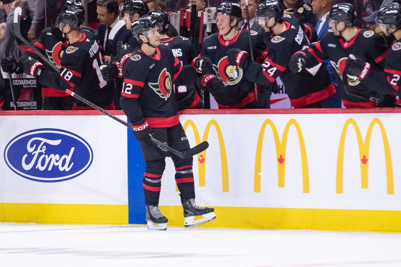 Oct 18, 2025; Ottawa, Ontario, CAN; Ottawa Senators center Shane Pinto (12) celebrates with team his goal scored in the second period against the New York Islanders at the Canadian Tire Centre. Mandatory Credit: Marc DesRosiers-IMAGN Images