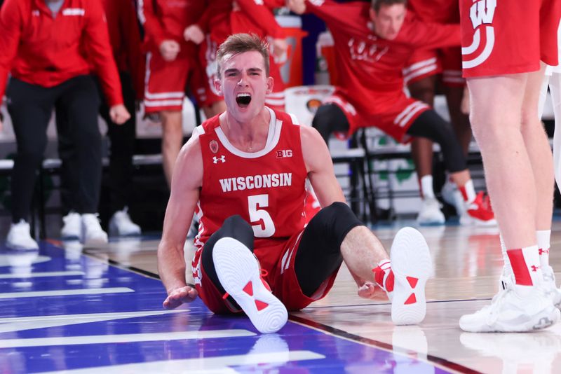 Nov 24, 2022; Paradise Island, BAHAMAS; Wisconsin Badgers forward Tyler Wahl (5) reacts after scoring during the game against the Kansas Jayhawks at Imperial Arena. Mandatory Credit: Kevin Jairaj-USA TODAY Sports