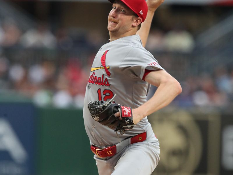 Jun 30, 2025; Pittsburgh, Pennsylvania, USA;  St. Louis Cardinals starting pitcher Erick Fedde (12) delivers a pitch against the Pittsburgh Pirates during the first inning at PNC Park. Mandatory Credit: Charles LeClaire-Imagn Images