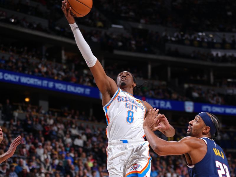 DENVER, CO - NOVEMBER 6: Jalen Williams #8 of the Oklahoma City Thunder drives to the basket during the game against the Denver Nuggets on November 6, 2024 at Ball Arena in Denver, Colorado. NOTE TO USER: User expressly acknowledges and agrees that, by downloading and/or using this Photograph, user is consenting to the terms and conditions of the Getty Images License Agreement. Mandatory Copyright Notice: Copyright 2024 NBAE (Photo by Garrett Ellwood/NBAE via Getty Images)
