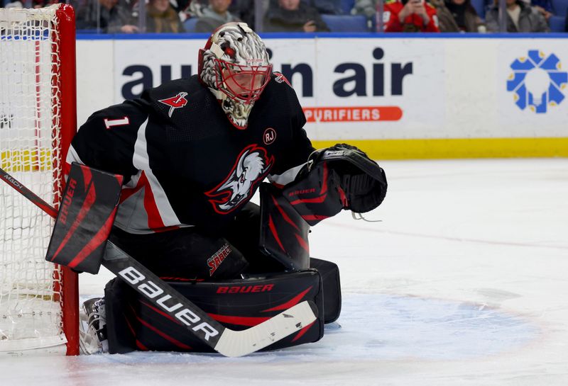 Jan 18, 2024; Buffalo, New York, USA;  Buffalo Sabres goaltender Ukko-Pekka Luukkonen (1) looks for the pic during the first period against the Chicago Blackhawks at KeyBank Center. Mandatory Credit: Timothy T. Ludwig-USA TODAY Sports