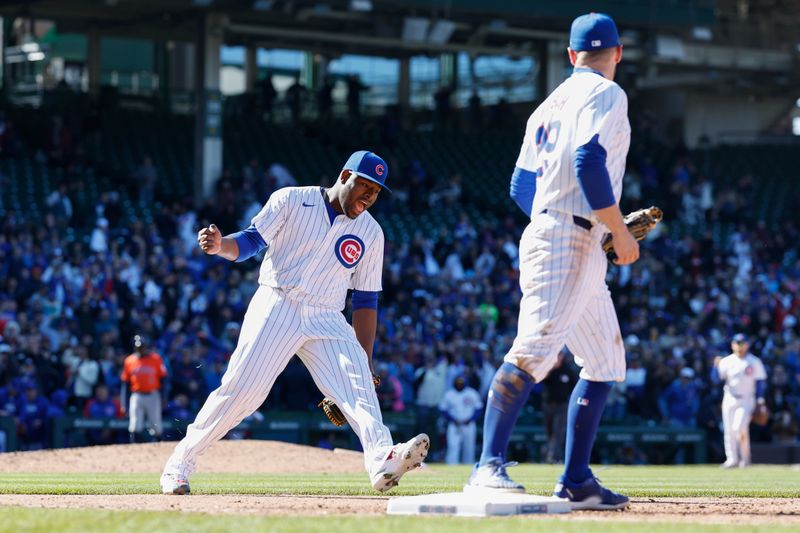 Apr 25, 2024; Chicago, Illinois, USA; Chicago Cubs relief pitcher Héctor Neris (51) celebrates team's win against the Houston Astros at Wrigley Field. Mandatory Credit: Kamil Krzaczynski-USA TODAY Sports