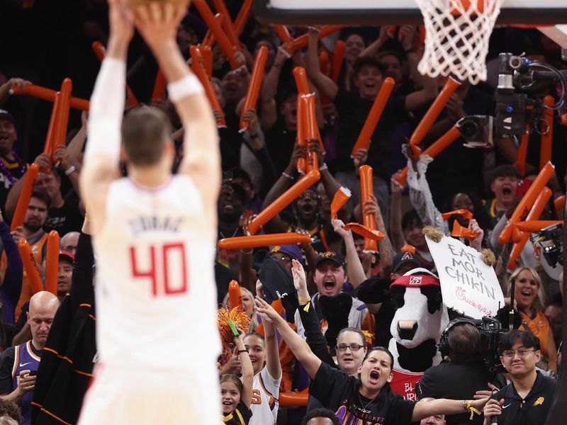 PHOENIX, ARIZONA - APRIL 18: Fans attempt to distract Ivica Zubac #40 of the LA Clippers as he take a free-throw shot during the second half of Game Two of the Western Conference First Round Playoffs at Footprint Center on April 18, 2023 in Phoenix, Arizona. The Suns defeated the Clippers 123-109. NOTE TO USER: User expressly acknowledges and agrees that, by downloading and or using this photograph, User is consenting to the terms and conditions of the Getty Images License Agreement.  (Photo by Christian Petersen/Getty Images)