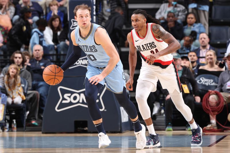 MEMPHIS, TN - MARCH 2:  Luke Kennard #10 of the Memphis Grizzlies dribbles the ball during the game against the Portland Trail Blazers on March 2, 2024 at FedExForum in Memphis, Tennessee. NOTE TO USER: User expressly acknowledges and agrees that, by downloading and or using this photograph, User is consenting to the terms and conditions of the Getty Images License Agreement. Mandatory Copyright Notice: Copyright 2024 NBAE (Photo by Joe Murphy/NBAE via Getty Images)