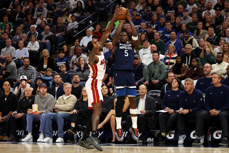 MINNEAPOLIS, MINNESOTA - NOVEMBER 10: Anthony Edwards #5 of the Minnesota Timberwolves shoots the ball against Haywood Highsmith #24 of the Miami Heat in the first quarter at Target Center on November 10, 2024 in Minneapolis, Minnesota. NOTE TO USER: User expressly acknowledges and agrees that, by downloading and or using this photograph, User is consenting to the terms and conditions of the Getty Images License Agreement. (Photo by David Berding/Getty Images)