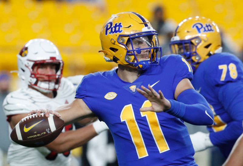 Oct 14, 2023; Pittsburgh, Pennsylvania, USA; Pittsburgh Panthers quarterback Christian Veilleux (11) passes against the Louisville Cardinals during the first quarter at Acrisure Stadium. Mandatory Credit: Charles LeClaire-USA TODAY Sports