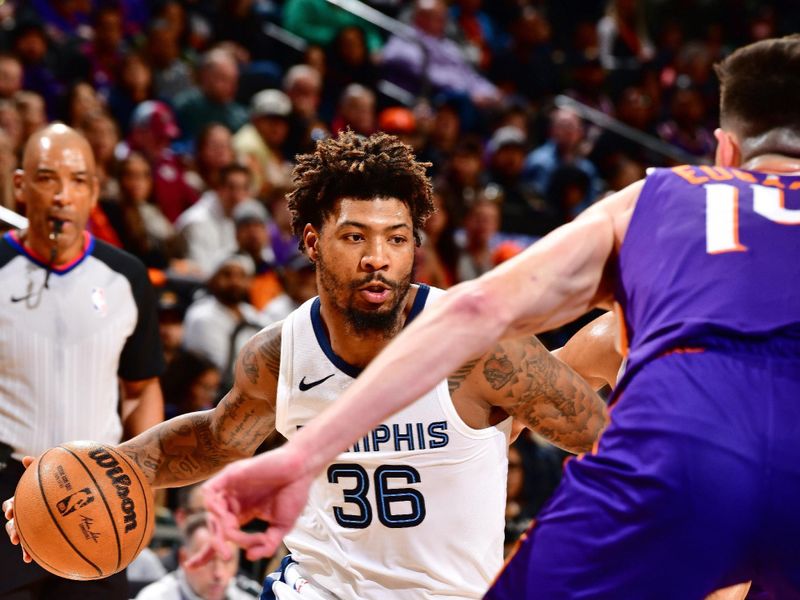 PHOENIX, AZ - JANUARY 7: Marcus Smart #36 of the Memphis Grizzlies dribbles the ball during the game against the Phoenix Suns on January 7, 2024 at Footprint Center in Phoenix, Arizona. NOTE TO USER: User expressly acknowledges and agrees that, by downloading and or using this photograph, user is consenting to the terms and conditions of the Getty Images License Agreement. Mandatory Copyright Notice: Copyright 2024 NBAE (Photo by Barry Gossage/NBAE via Getty Images)