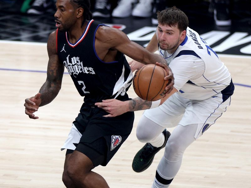 LOS ANGELES, CALIFORNIA - APRIL 23: Luka Doncic #77 of the Dallas Mavericks attempts a steal on Kawhi Leonard #2 of the LA Clippers during the first half at Crypto.com Arena on April 23, 2024 in Los Angeles, California. User is consenting to the terms and conditions of the Getty Images License Agreement. (Photo by Harry How/Getty Images)