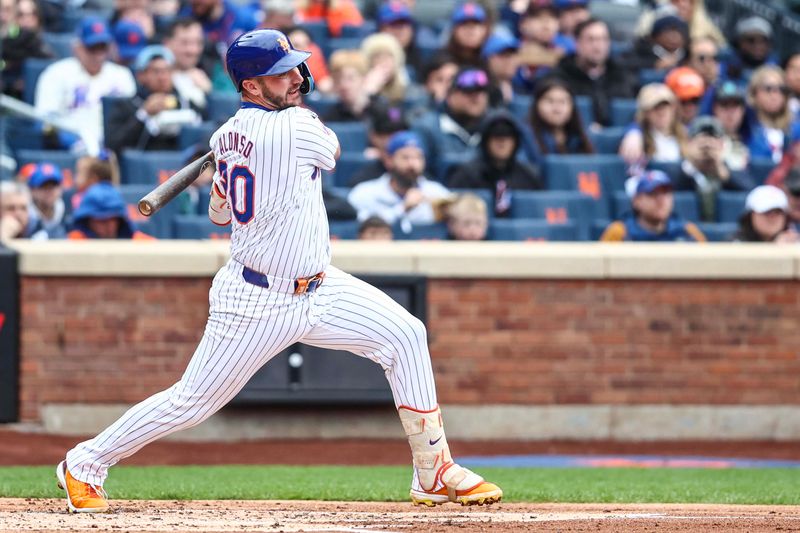 Apr 13, 2024; New York City, New York, USA;  New York Mets first baseman Pete Alonso (20) hits an RBI single in the first inning against the Kansas City Royals at Citi Field. Mandatory Credit: Wendell Cruz-USA TODAY Sports