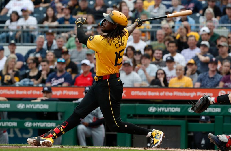 Jun 7, 2024; Pittsburgh, Pennsylvania, USA;  Pittsburgh Pirates shortstop Oneil Cruz (15) hits a solo home run against the Minnesota Twins during the second inning at PNC Park. Mandatory Credit: Charles LeClaire-USA TODAY Sports