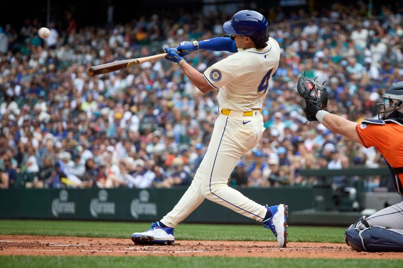 Jul 21, 2024; Seattle, Washington, USA; Seattle Mariners third baseman Josh Rojas (4) hits a double against the Houston Astros during the second inning at T-Mobile Park. Mandatory Credit: John Froschauer-USA TODAY Sports