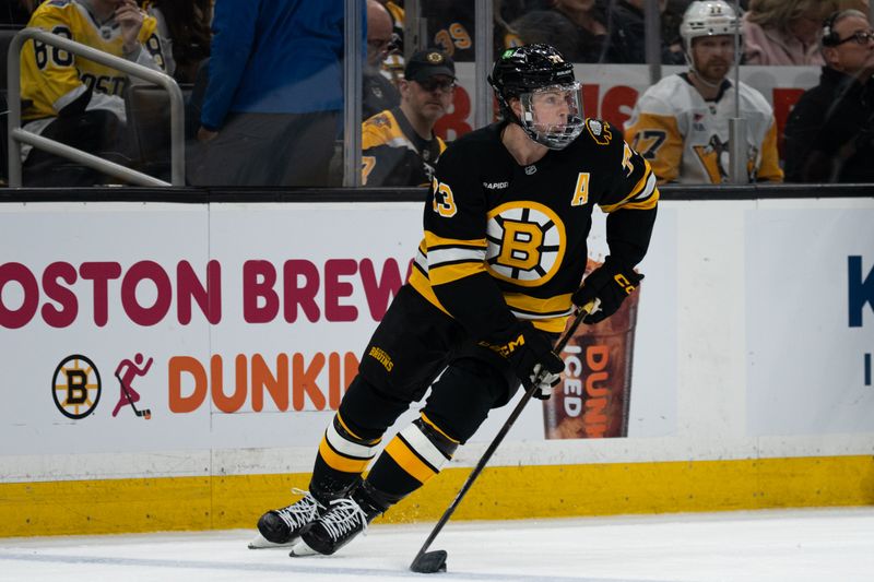 Jan 11, 2026; Boston, Massachusetts, USA; Boston Bruins defenseman Charlie McAvoy (73) skates with the puck during the second period of the game against the Pittsburgh Penguins at TD Garden. Mandatory Credit: Natalie Reid-Imagn Images