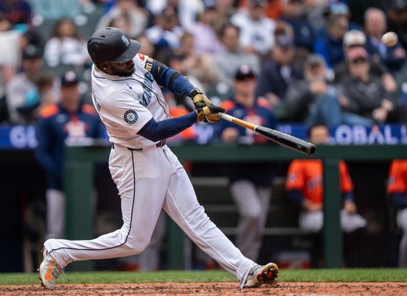 Apr 9, 2025; Seattle, Washington, USA;  Seattle Mariners left fielder Randy Arozarena (56) hits a grand slam home run during the eighth inning against the Houston Astros at T-Mobile Park. Mandatory Credit: Stephen Brashear-Imagn Images
