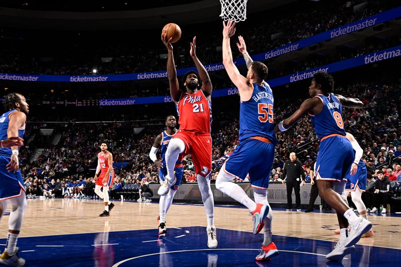 PHILADELPHIA, PA - JANUARY 5:  Joel Embiid #21 of the Philadelphia 76ers drives to the basket during the game against the New York Knicks on January 5, 2024 at the Wells Fargo Center in Philadelphia, Pennsylvania NOTE TO USER: User expressly acknowledges and agrees that, by downloading and/or using this Photograph, user is consenting to the terms and conditions of the Getty Images License Agreement. Mandatory Copyright Notice: Copyright 2024 NBAE (Photo by David Dow/NBAE via Getty Images)