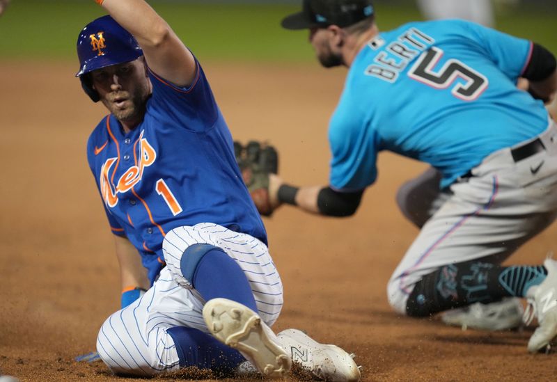 Feb 25, 2023; Port St. Lucie, Florida, USA;  New York Mets second baseman Jeff McNeil (1) gets to third base ahead of the tag of Miami Marlins second baseman Jon Berti (5) in the third inning at Clover Park. Mandatory Credit: Jim Rassol-USA TODAY Sports