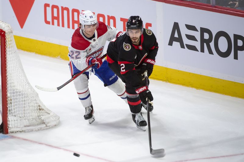 Apr 13, 2024; Ottawa, Ontario, CAN; Montreal Canadiens right wing Cole Caufield (22) battles with Ottawa Senators defenseman Artem Zub (2) in the third period at the Canadian Tire Centre. Mandatory Credit: Marc DesRosiers-USA TODAY Sports