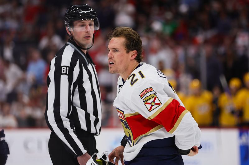 Mar 21, 2024; Sunrise, Florida, USA; Florida Panthers center Nick Cousins (21) looks on after fighting against Nashville Predators left wing Jason Zucker (not pictured) during the first period at Amerant Bank Arena. Mandatory Credit: Sam Navarro-USA TODAY Sports