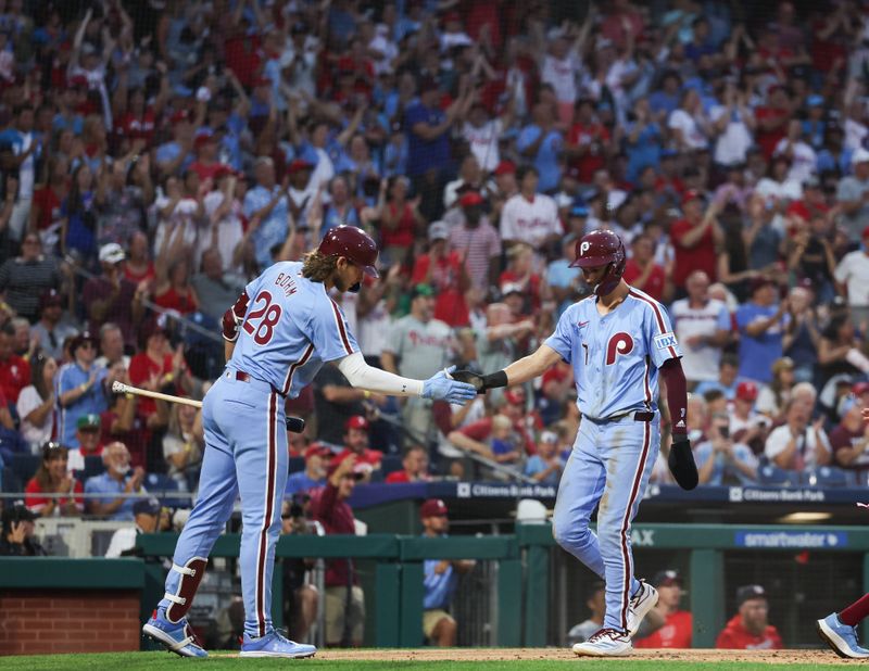 Aug 15, 2024; Philadelphia, Pennsylvania, USA; Philadelphia Phillies shortstop Trea Turner (7) is congratulated by third base Alec Bohm (28) after scoring during the fourth inning against the Washington Nationals at Citizens Bank Park. Mandatory Credit: Bill Streicher-USA TODAY Sports