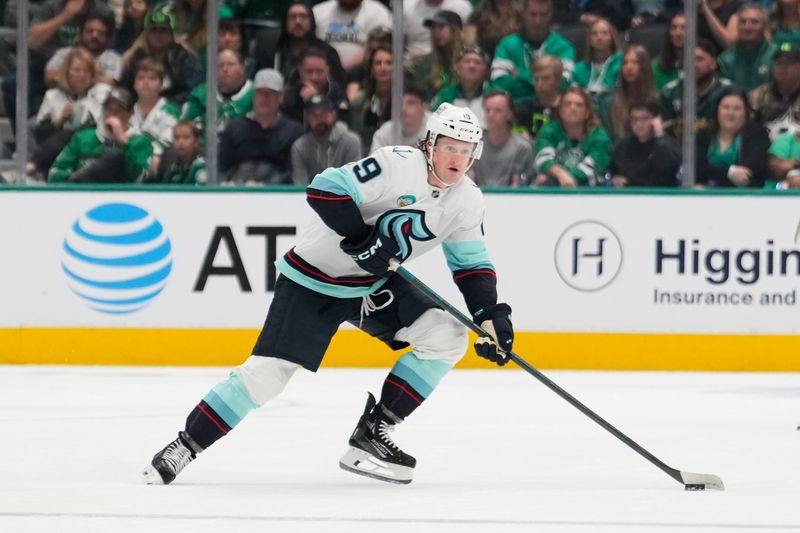 Oct 13, 2024; Dallas, Texas, USA;  Seattle Kraken left wing Jared McCann (19) in action against the Dallas Stars during the first period at American Airlines Center. Mandatory Credit: Chris Jones-Imagn Images