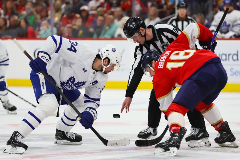 Apr 16, 2024; Sunrise, Florida, USA; Toronto Maple Leafs center Auston Matthews (34) and Florida Panthers center Aleksander Barkov (16) face-off during the first period at Amerant Bank Arena. Mandatory Credit: Sam Navarro-USA TODAY Sports