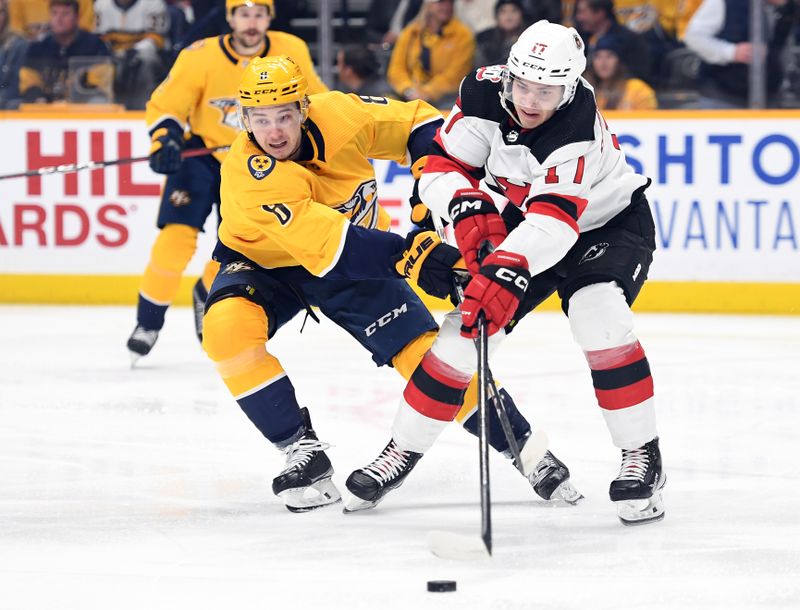 Jan 26, 2023; Nashville, Tennessee, USA; Nashville Predators center Cody Glass (8) knocks the puck away from New Jersey Devils center Yegor Sharangovich (17) during the first period at Bridgestone Arena. Mandatory Credit: Christopher Hanewinckel-USA TODAY Sports