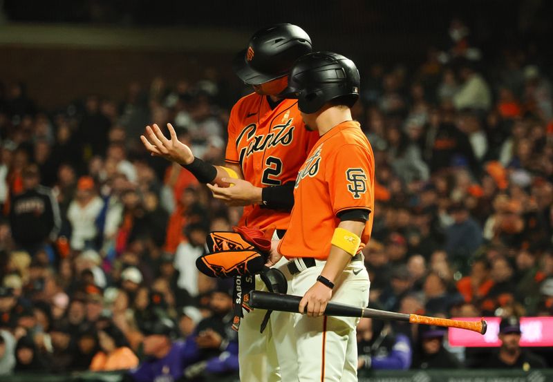 Sep 8, 2023; San Francisco, California, USA; San Francisco Giants catcher Blake Sabol (2) removes his batting glove after being hit by pitch during the eighth inning against the Colorado Rockies at Oracle Park. Mandatory Credit: Kelley L Cox-USA TODAY Sports