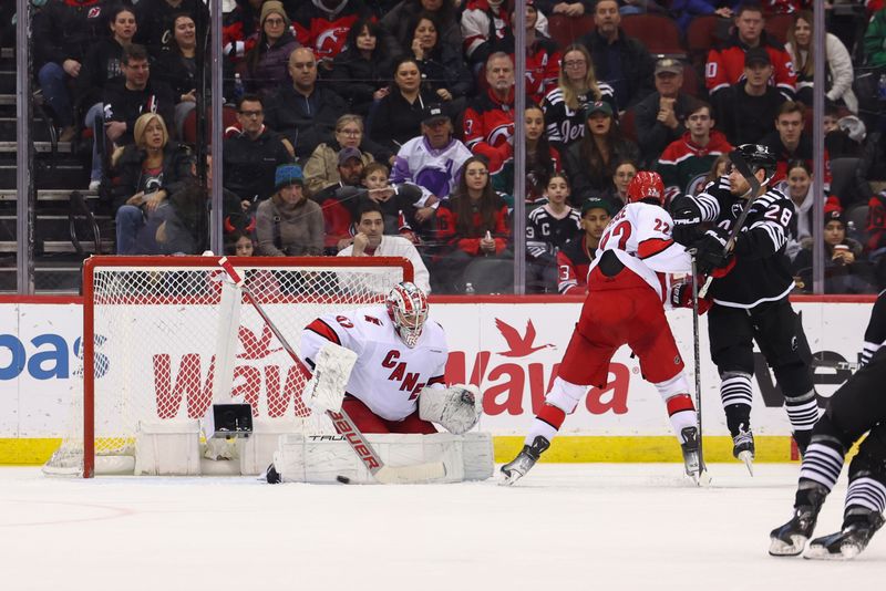 Mar 9, 2024; Newark, New Jersey, USA; Carolina Hurricanes goaltender Pyotr Kochetkov (52) makes a save against the New Jersey Devils during the third period at Prudential Center. Mandatory Credit: Ed Mulholland-USA TODAY Sports