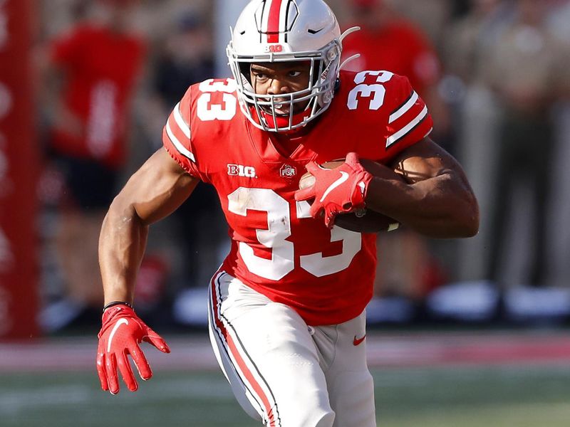 Sep 18, 2021; Columbus, Ohio, USA; Ohio State Buckeyes running back Master Teague III (33) runs the ball during the second quarter against the Tulsa Golden Hurricane at Ohio Stadium. Mandatory Credit: Joseph Maiorana-USA TODAY Sports