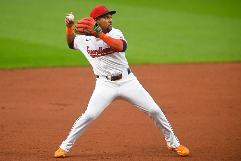 Sep 9, 2025; Cleveland, Ohio, USA; Cleveland Guardians third baseman Jose Ramirez (11) throws to first base in the second inning against the Kansas City Royals at Progressive Field. Mandatory Credit: David Richard-Imagn Images