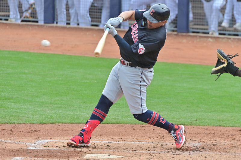 Feb 26, 2024; Peoria, Arizona, USA;  Cleveland Guardians first baseman Josh Naylor (22) singles in the third inning against the San Diego Padres during a spring training game at Peoria Sports Complex. Mandatory Credit: Matt Kartozian-USA TODAY Sports