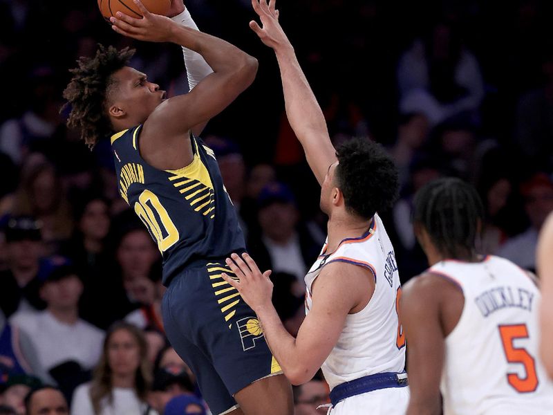 NEW YORK, NEW YORK - APRIL 09:  Bennedict Mathurin #00 of the Indiana Pacers takes a shot as Quentin Grimes #6 of the New York Knicks defends in the second half at Madison Square Garden on April 09, 2023 in New York City. NOTE TO USER: User expressly acknowledges and agrees that, by downloading and or using this photograph, User is consenting to the terms and conditions of the Getty Images License Agreement. (Photo by Elsa/Getty Images)