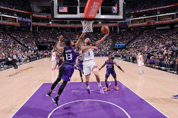 SACRAMENTO, CA - DECEMBER 22:  Devin Booker #1 of the Phoenix Suns goes to the basket during the game on December 22, 2023 at Golden 1 Center in Sacramento, California. NOTE TO USER: User expressly acknowledges and agrees that, by downloading and or using this Photograph, user is consenting to the terms and conditions of the Getty Images License Agreement. Mandatory Copyright Notice: Copyright 2023 NBAE (Photo by Rocky Widner/NBAE via Getty Images)