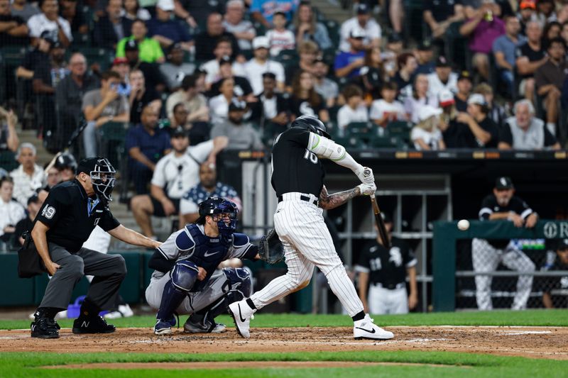 Aug 9, 2023; Chicago, Illinois, USA; Chicago White Sox third baseman Yoan Moncada (10) hits an RBI double against the New York Yankees during the third inning at Guaranteed Rate Field. Mandatory Credit: Kamil Krzaczynski-USA TODAY Sports