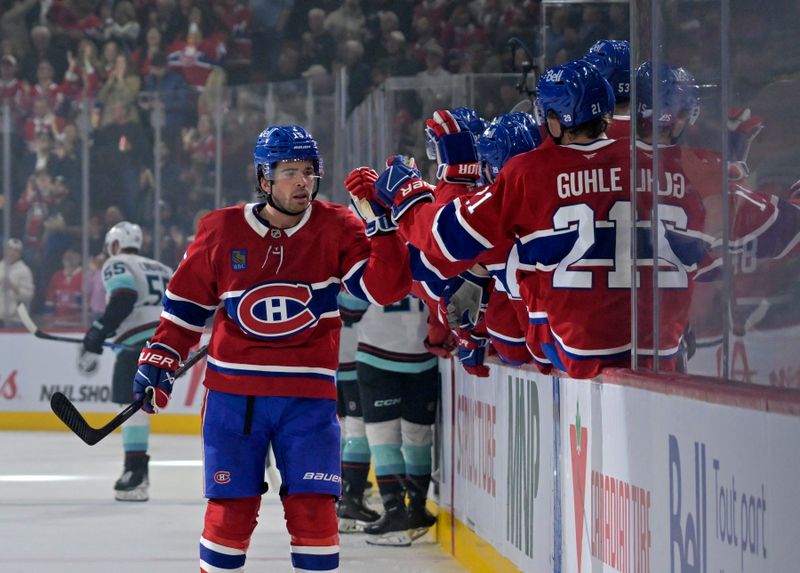 Oct 14, 2025; Montreal, Quebec, CAN; Montreal Canadiens forward Alex Newhook (15) celebrates with teammates after scoring a goal against the Seattle Kraken during the first period at the Bell Centre. Mandatory Credit: Eric Bolte-Imagn Images