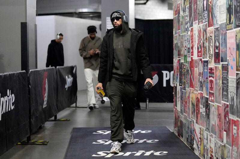 PORTLAND, OREGON - FEBRUARY 25: Cody Martin #11 of the Charlotte Hornets arrives at the arena prior to a game against the Portland Trail Blazers at Moda Center on February 25, 2024 in Portland, Oregon. NOTE TO USER: User expressly acknowledges and agrees that, by downloading and or using this photograph, User is consenting to the terms and conditions of the Getty Images License Agreement. (Photo by Soobum Im/Getty Images)