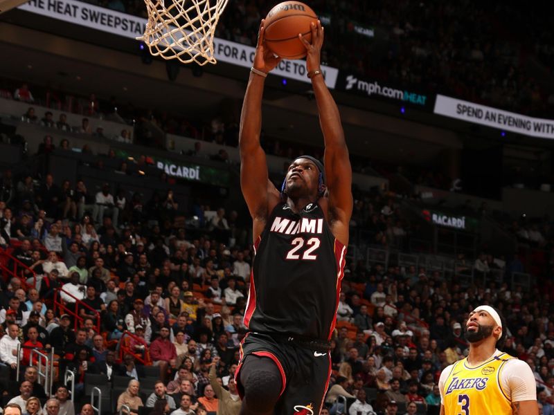 MIAMI, FL - DECEMBER 4: Jimmy Butler #22 of the Miami Heat dunks the ball during the game against the Los Angeles Lakers on December 4, 2024 at Kaseya Center in Miami, Florida. NOTE TO USER: User expressly acknowledges and agrees that, by downloading and or using this Photograph, user is consenting to the terms and conditions of the Getty Images License Agreement. Mandatory Copyright Notice: Copyright 2024 NBAE (Photo by Issac Baldizon/NBAE via Getty Images)