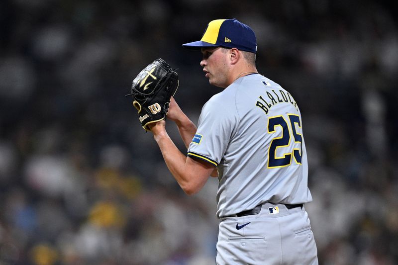 Jun 20, 2024; San Diego, California, USA; Milwaukee Brewers relief pitcher Bradley Blalock (25) prepares to pitch against the San Diego Padres during the eighth inning at Petco Park. Mandatory Credit: Orlando Ramirez-USA TODAY Sports