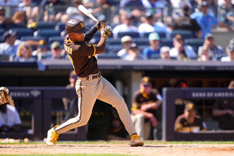 May 28, 2023; Bronx, New York, USA; San Diego Padres right fielder Jose Azocar (28) hits an RBI single against the New York Yankees during the seventh inning at Yankee Stadium. Mandatory Credit: Gregory Fisher-USA TODAY Sports