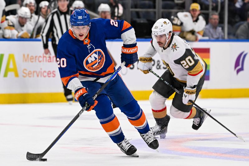 Jan 23, 2024; Elmont, New York, USA;  New York Islanders right wing Hudson Fasching (20) skates across the blue line against the Vegas Golden Knights during the second period at UBS Arena. Mandatory Credit: Dennis Schneidler-USA TODAY Sports