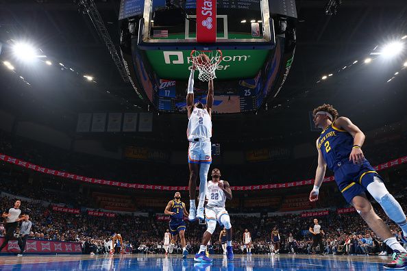 OKLAHOMA CITY, OK - DECEMBER 8: Shai Gilgeous-Alexander #2 of the Oklahoma City Thunder dunks the ball during the game against the Golden State Warriors on December 8, 2023 at Paycom Arena in Oklahoma City, Oklahoma. NOTE TO USER: User expressly acknowledges and agrees that, by downloading and or using this photograph, User is consenting to the terms and conditions of the Getty Images License Agreement. Mandatory Copyright Notice: Copyright 2023 NBAE (Photo by Zach Beeker/NBAE via Getty Images)