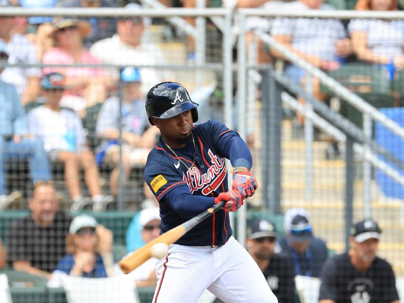 Mar 13, 2026; North Port, Florida, USA;  Atlanta Braves second baseman Ozzie Albies (1) doubles during the first inning against the New York Yankees at CoolToday Park. Mandatory Credit: Kim Klement Neitzel-Imagn Images