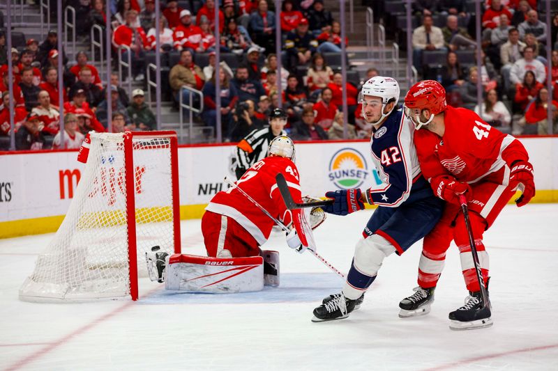 Mar 19, 2024; Detroit, Michigan, USA; Columbus Blue Jackets center Alexandre Texier (42) scores a goal during the first period of the game against the Detroit Red Wings at Little Caesars Arena. Mandatory Credit: Brian Bradshaw Sevald-USA TODAY Sports