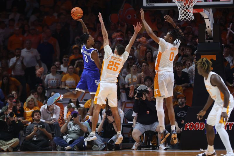 Mar 9, 2024; Knoxville, Tennessee, USA; Kentucky Wildcats guard Rob Dillingham (0) goes to the basket against Tennessee Volunteers guard Santiago Vescovi (25) during the second half at Thompson-Boling Arena at Food City Center. Mandatory Credit: Randy Sartin-USA TODAY Sports