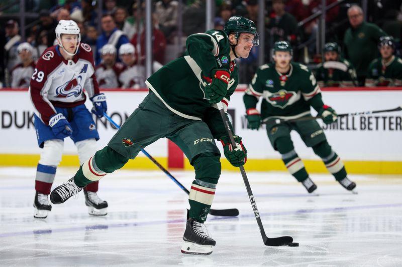 Nov 28, 2025; Saint Paul, Minnesota, USA; Minnesota Wild center Joel Eriksson Ek (14) skates with the puck against the Colorado Avalanche during the second period at Grand Casino Arena. Mandatory Credit: Matt Krohn-Imagn Images