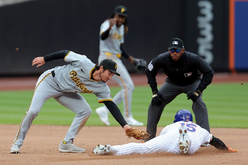 Apr 17, 2024; New York City, New York, USA; New York Mets right fielder Tyrone Taylor (15) steals second base ahead of the tag by Pittsburgh Pirates second baseman Alika Williams (25) during the fourth inning at Citi Field. Mandatory Credit: Brad Penner-USA TODAY Sports