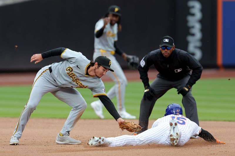 Apr 17, 2024; New York City, New York, USA; New York Mets right fielder Tyrone Taylor (15) steals second base ahead of the tag by Pittsburgh Pirates second baseman Alika Williams (25) during the fourth inning at Citi Field. Mandatory Credit: Brad Penner-USA TODAY Sports